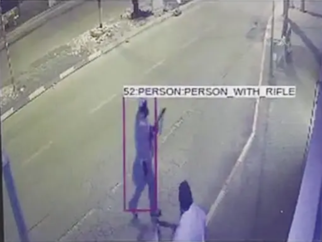 person with rifle